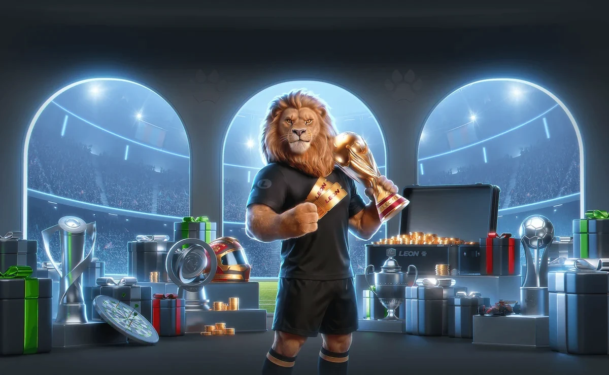 LEON lion mascot in a black kit holding a gold trophy inside a floodlit stadium